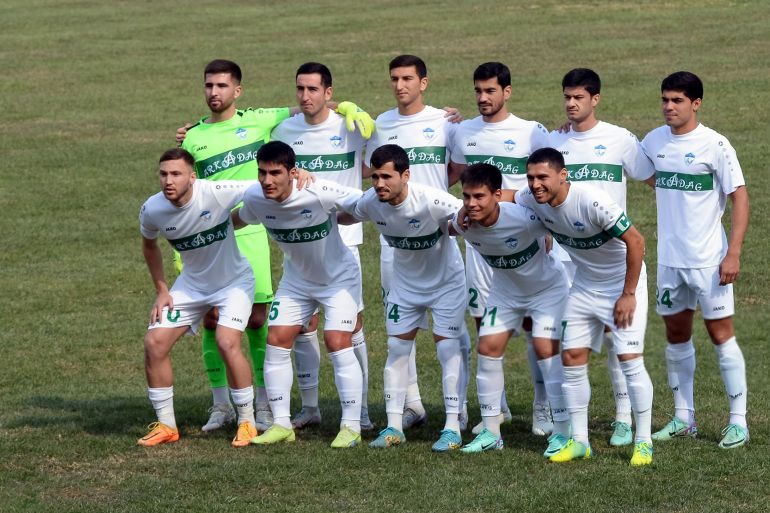 FK Arkadag's players pose for a team picture prior to their Turkmen football championship game against Altyn Asyr at a stadium in Ashgabat on March 7, 2024. Forget Real Madrid, Manchester City or Paris Saint-Germain. The world's best football team -- statistically speaking -- might be a little-known outfit from the closed central Asian nation of Turkmenistan. Founded last year, FK Arkadag, named in honour of strongman former president Gurbanguly Berdimuhamedow, has been unstoppable, notching up 36 consecutive domestic victories in a run still ongoing. (Photo by Igor SASIN / AFP) (Photo by IGOR SASIN/AFP via Getty Images)