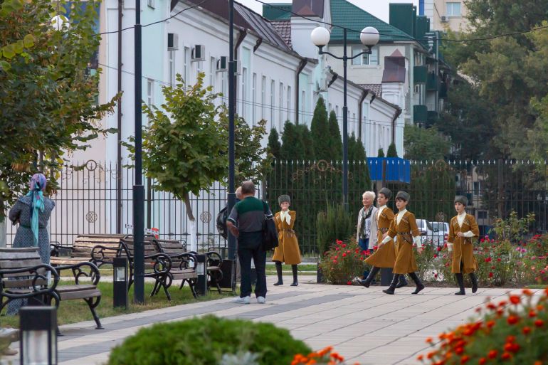 Grozny, Russia: 10.07.2015. Daily life in Chechen Republic. Boys dance group in traditional costumes walk down the street